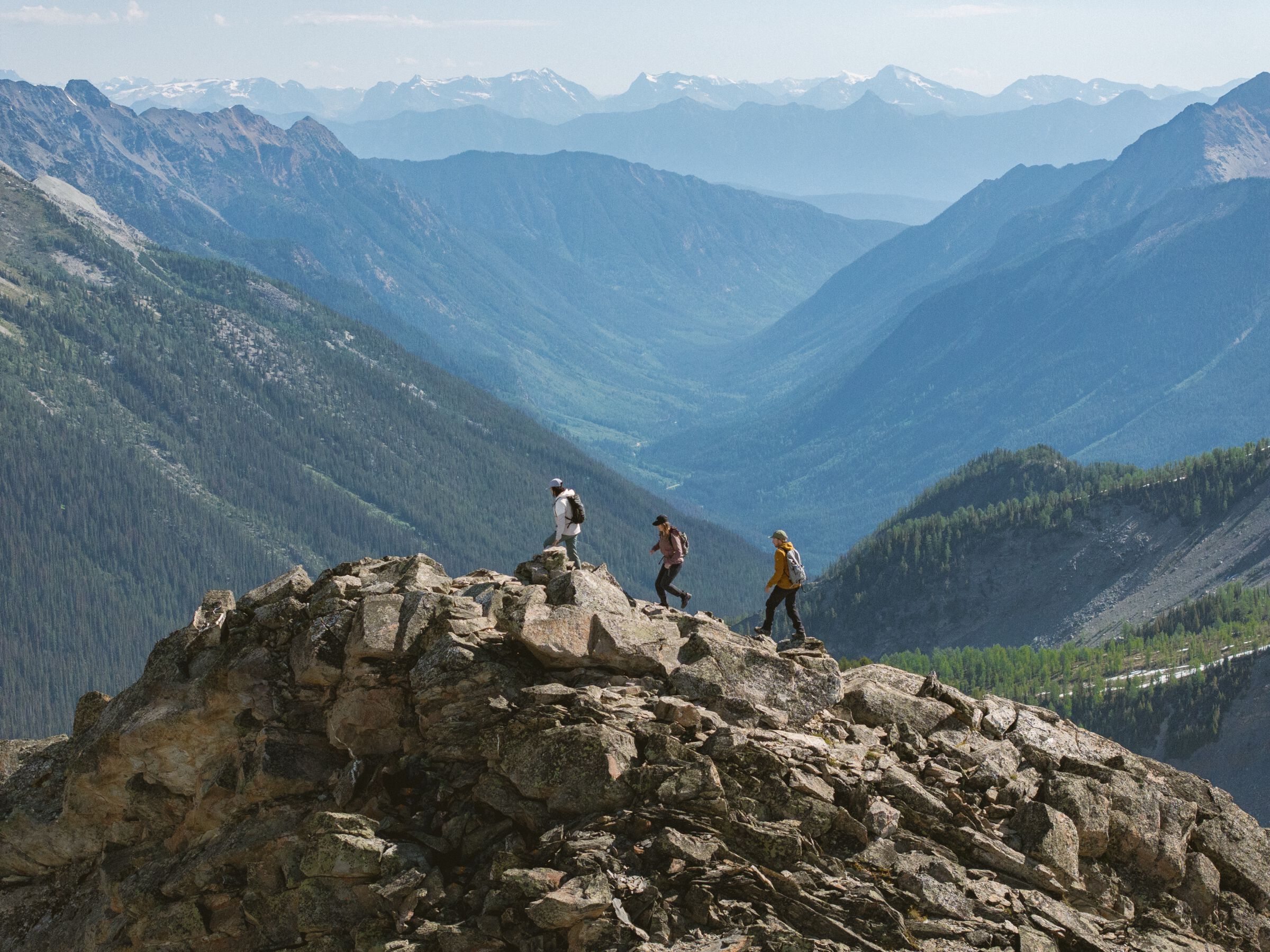 Three friends heli-hiking in the Bugaboos during a guided trip with CMH Bugaboos.