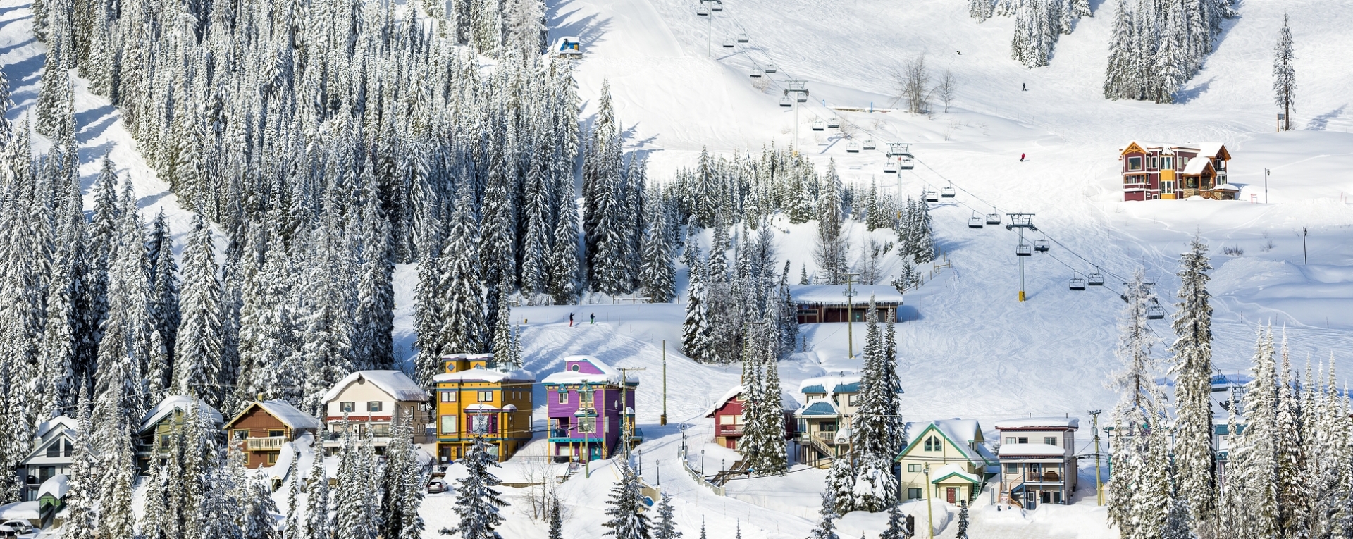 A view of a ski village at the base of a mountain in BC