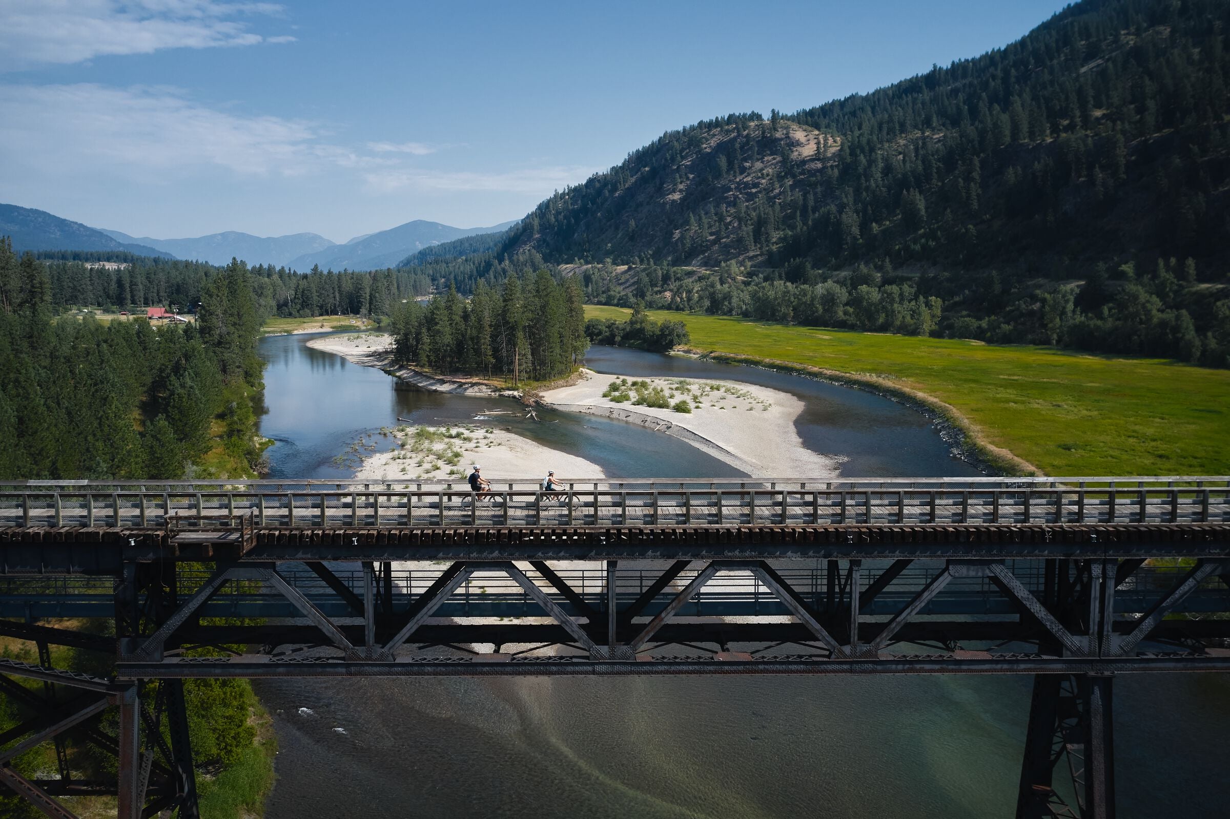 Biking on a trestle bridge on the Kettle Valley Trail in Christina Lake