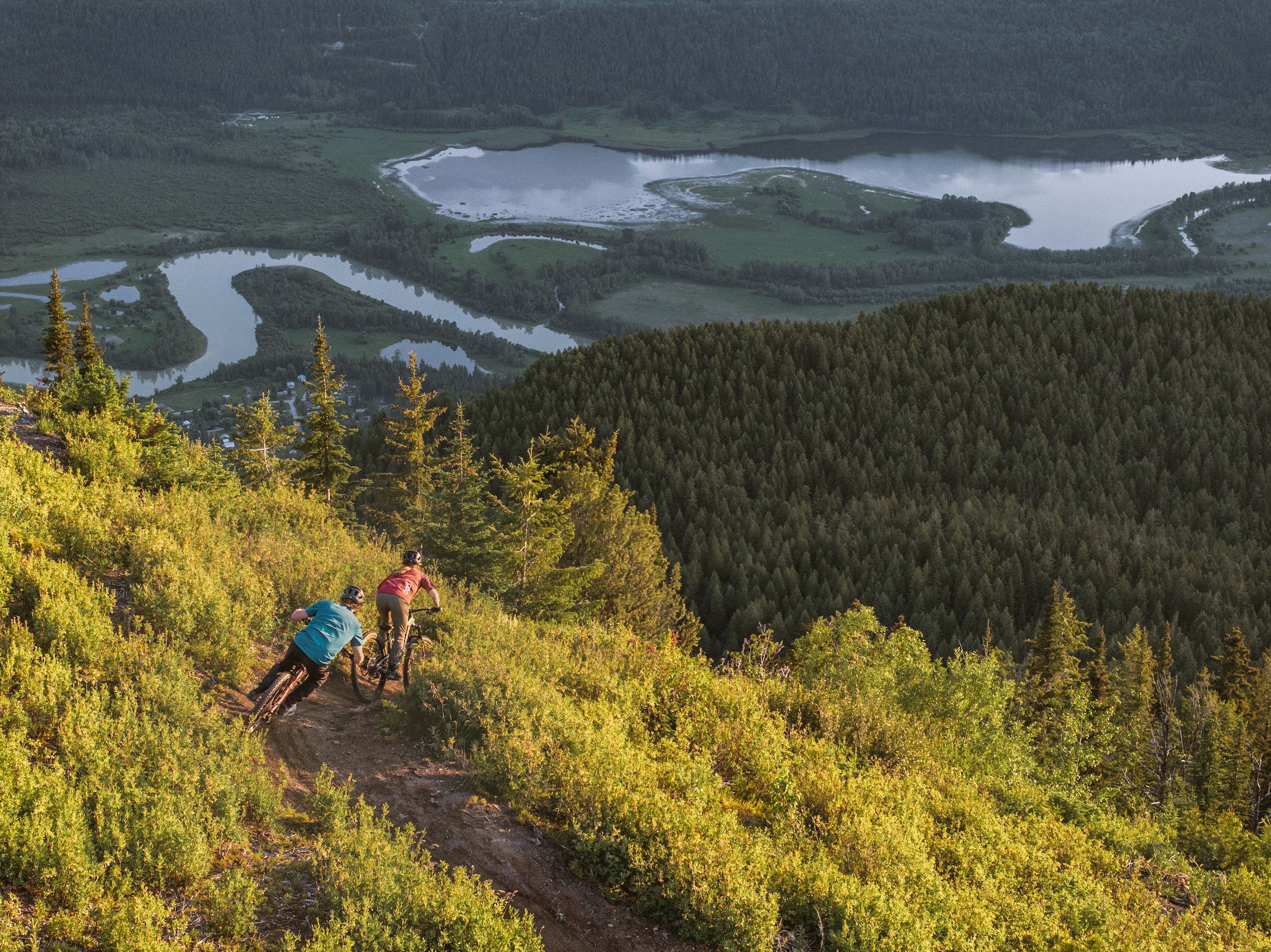 Two friends biking down Mount 7, Golden's hotspot for downhill biking.