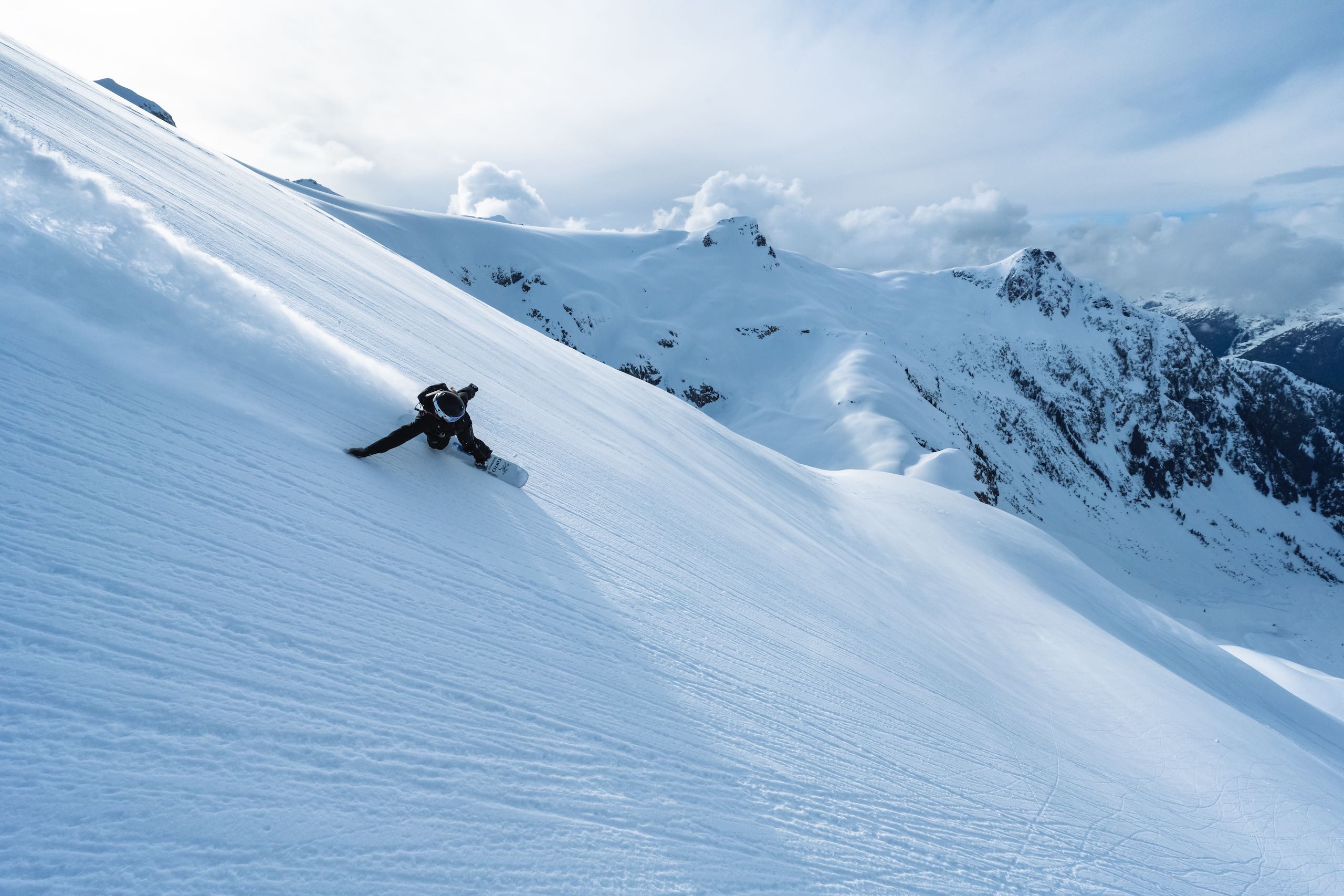 A snowboarder on a hill in British Columbia