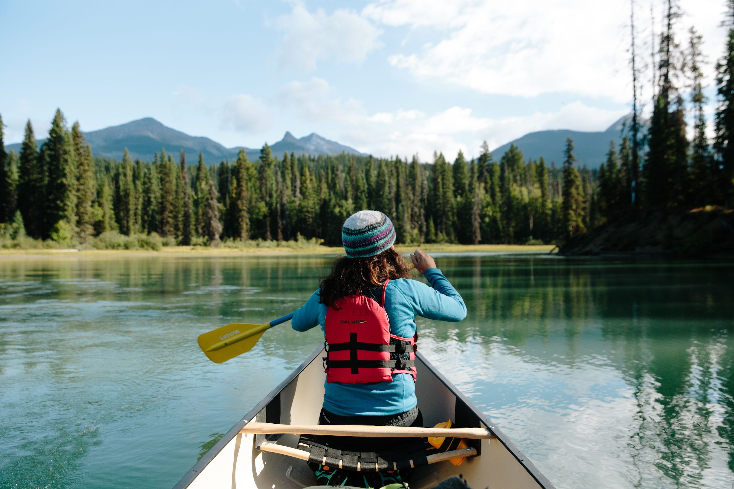 Canoer paddling along the Bowron Lake Provincial Park