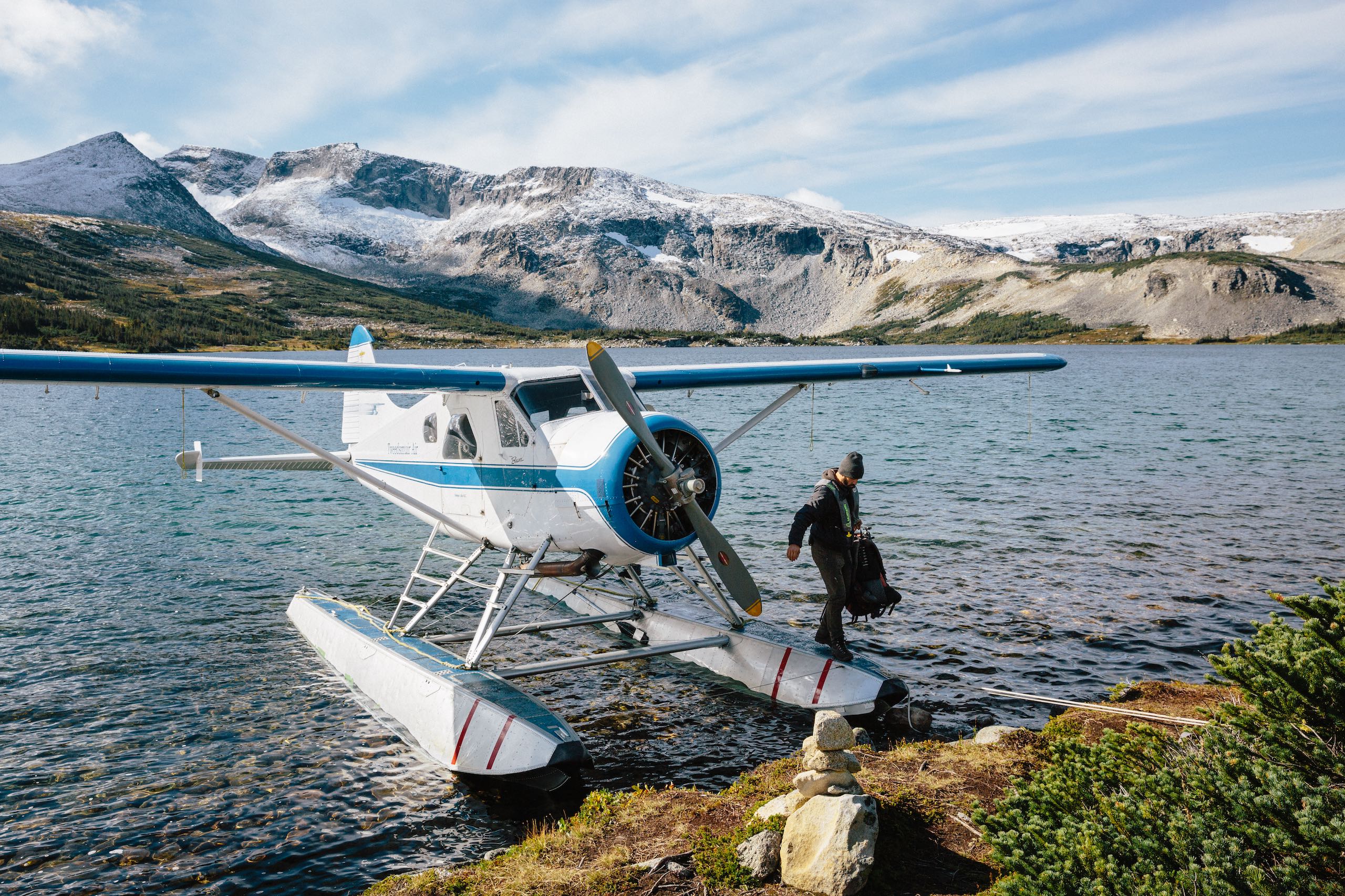 Person getting of a plane on Ptarmigan Lake