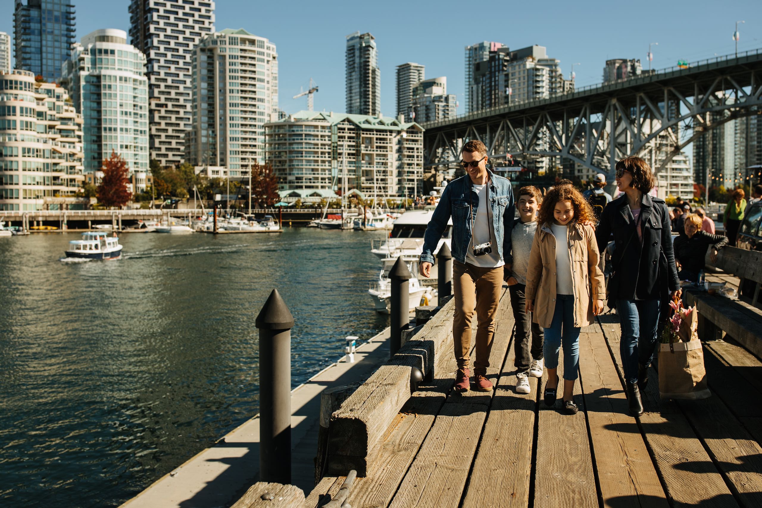 Family walking outside at Granville Island