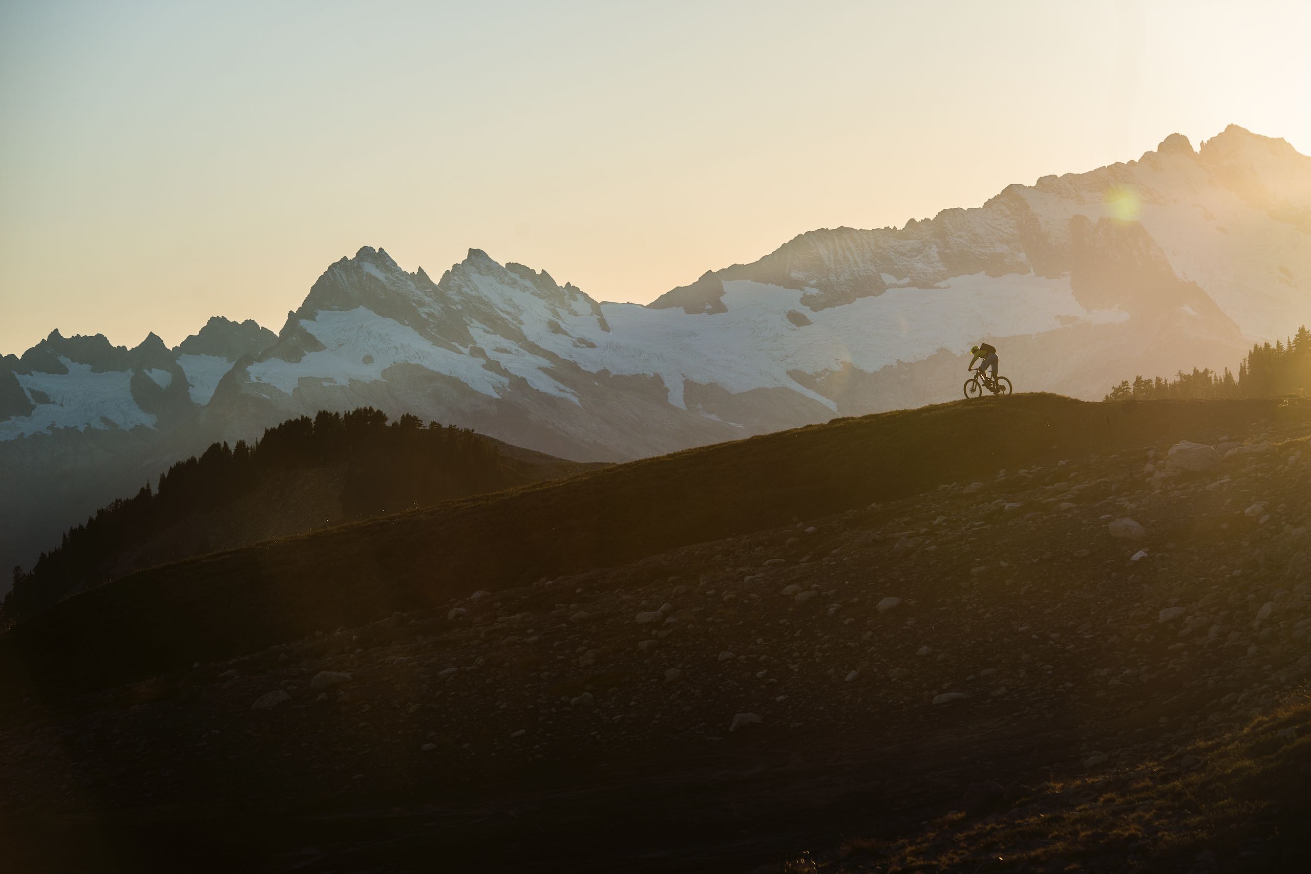 Person biking up a mountain in Whistler, BC