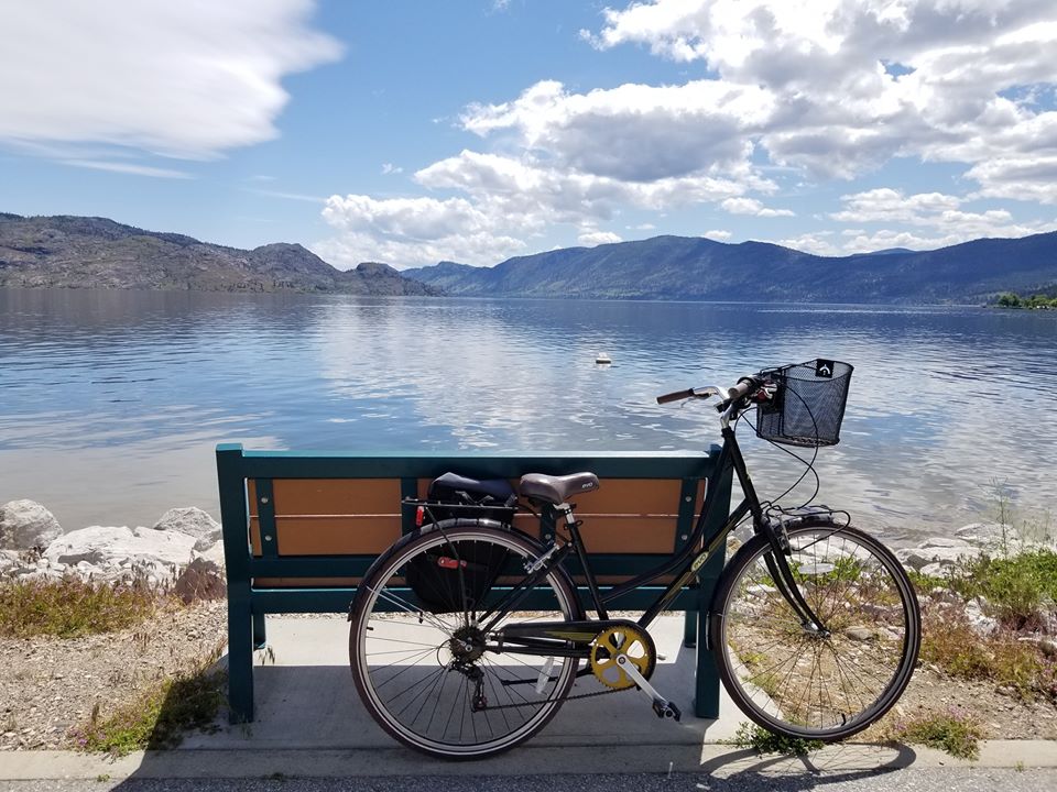 A bicycle against a bench in Peachland
