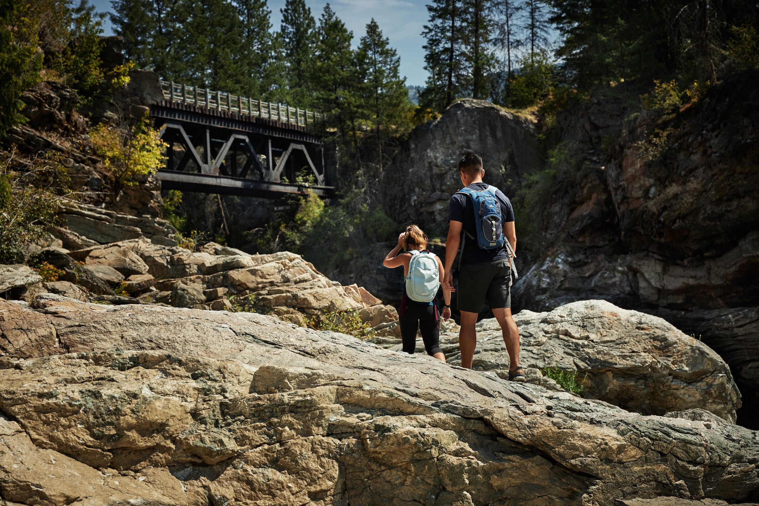 Two people hiking at Cascade Falls near Christina Lake
