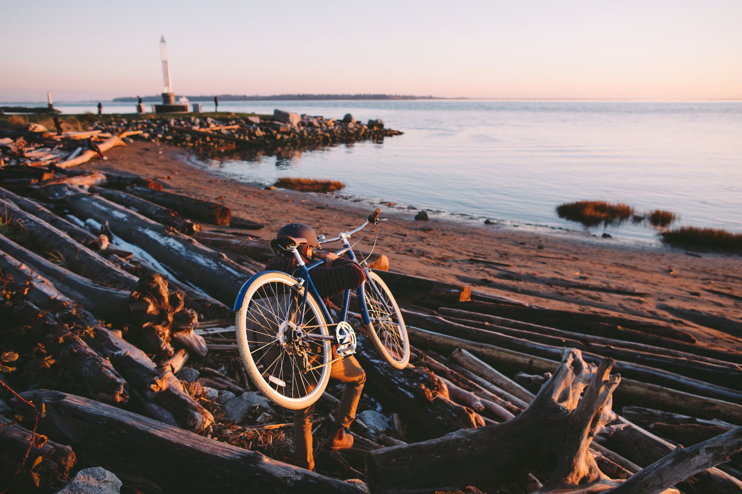 Cyclist carrying bike to the bay in Richmond